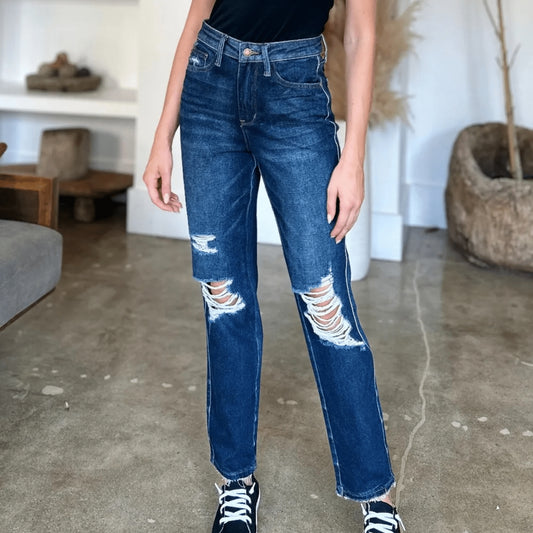 Full view of person wearing Judy Blue heavy destroy straight jeans.