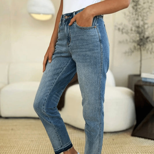 Judy Blue mid-rise rigid magic release hem jeans in a classic medium wash.