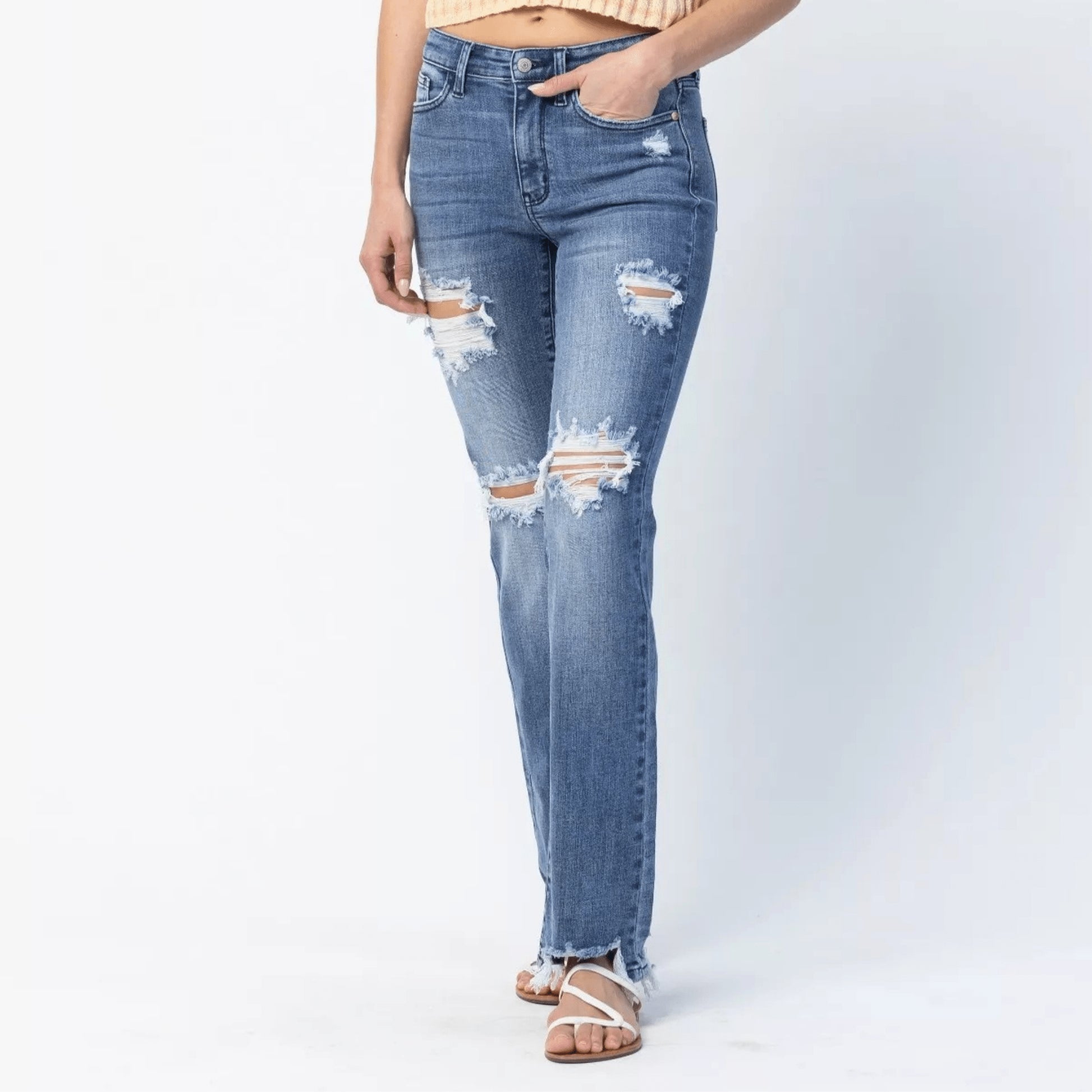 Full length view of Judy Blue plus size straight leg jeans with ripped accents.