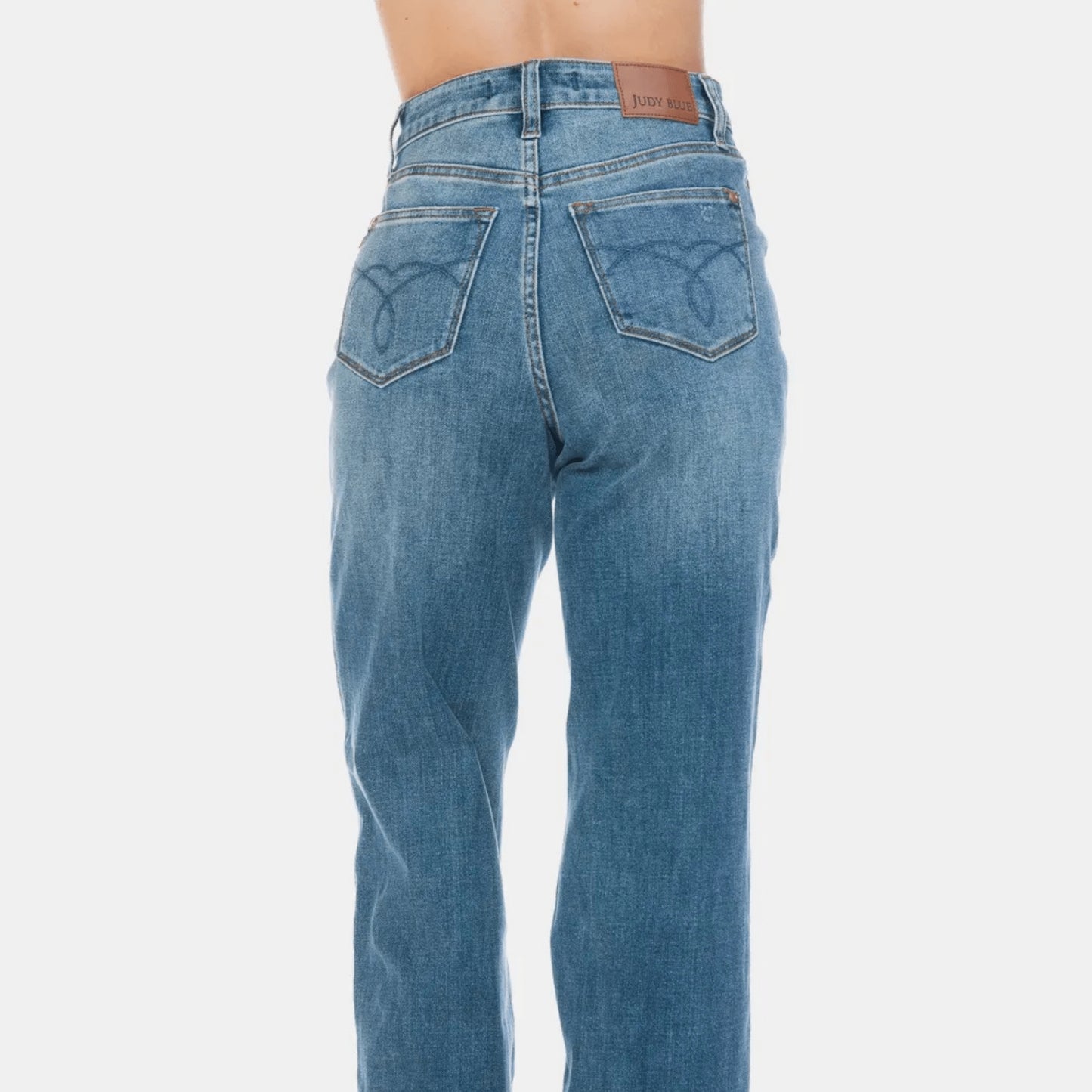 Back view of high-waist straight jeans showing the classic pocket placement and wash.