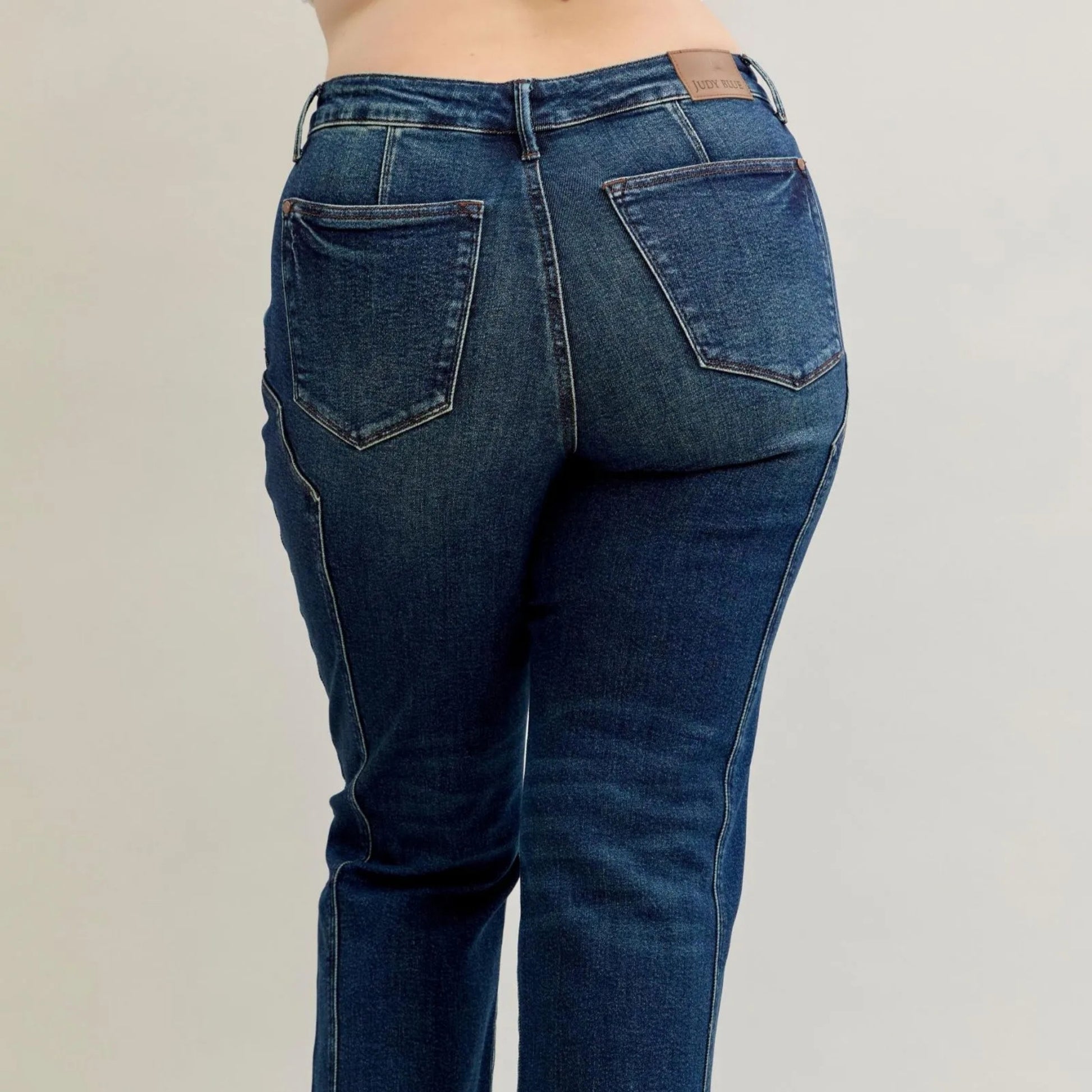 Detailed shot of the high-quality dark wash denim and stretch recovery on Judy Blue jeans.
