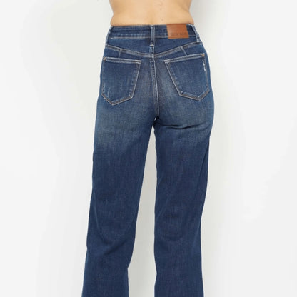 Back view of dark wash tummy control skinny jeans showing pocket detail.