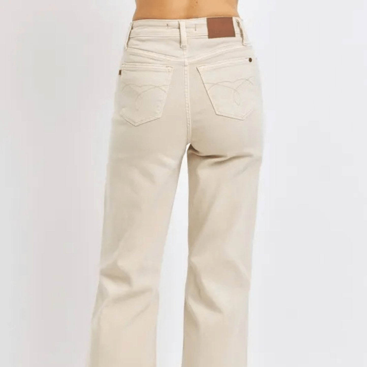 Back view of high-waist bone-colored wide-leg jeans.