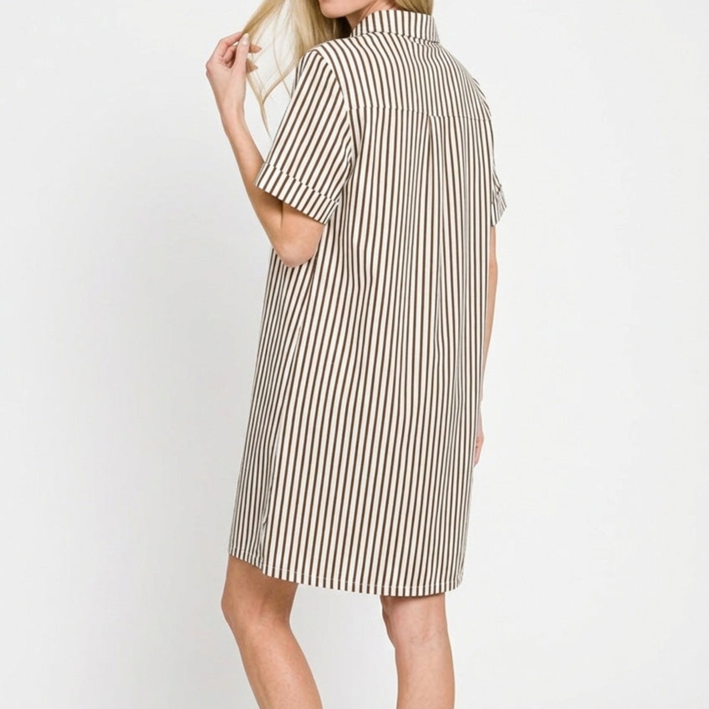 Lifestyle view of the Brown striped collared dress styled for a chic, natural coastal look.