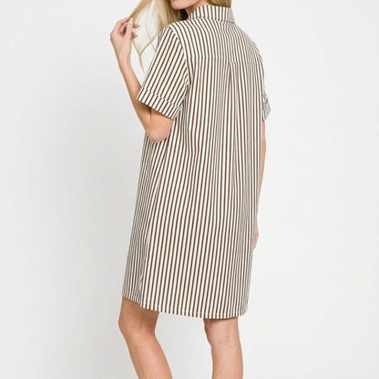 Lifestyle view of the Brown striped collared dress styled for a chic, natural coastal look.