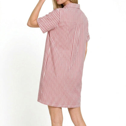 Lifestyle view of the Ruby striped collared dress styled for a chic, vibrant coastal look.