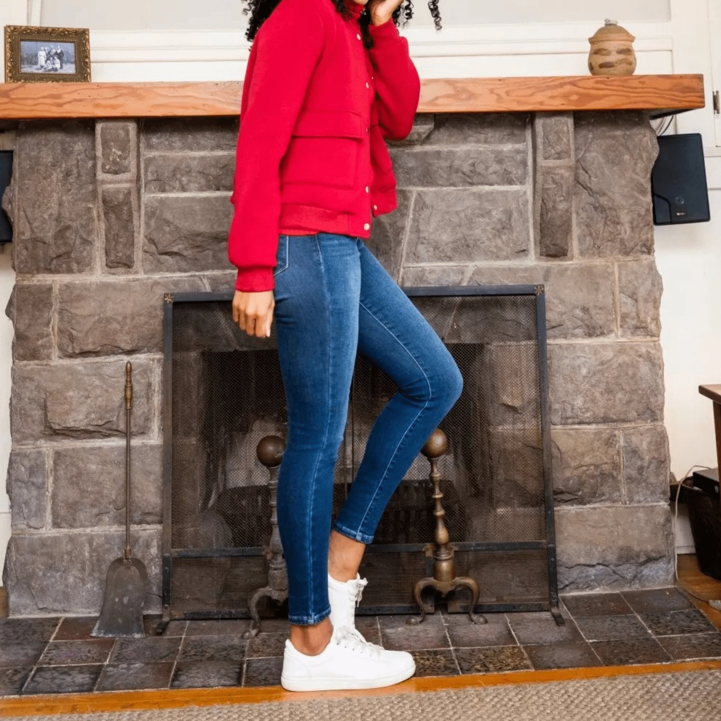 Lifestyle shot of a woman wearing thermal skinny jeans for a cozy, fashion-forward winter boutique look.