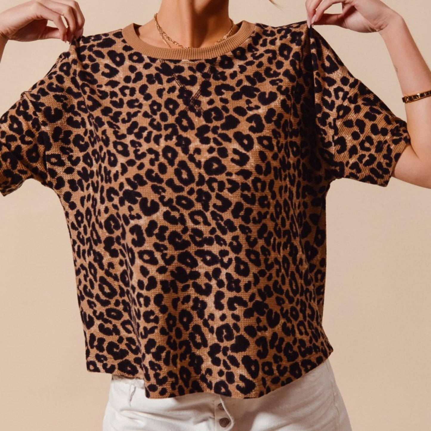 Casual outfit view of the loose-fit SO ME leopard thermal top.