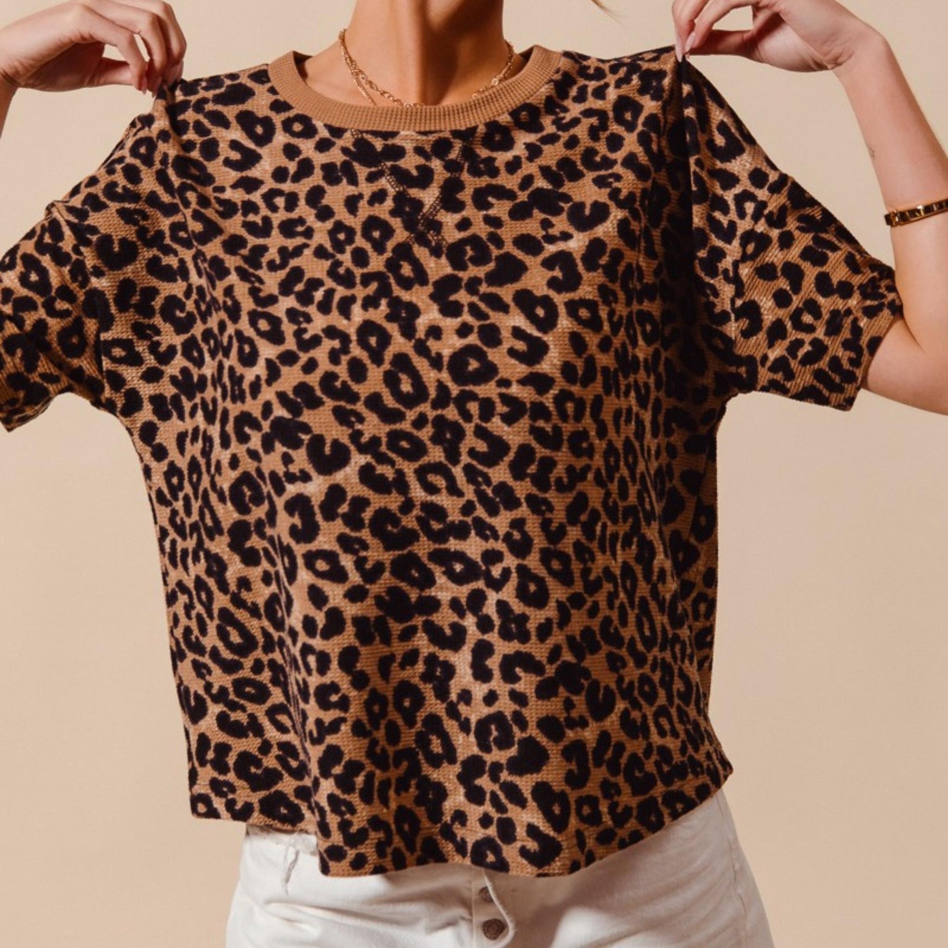 Casual outfit view of the loose-fit SO ME leopard thermal top.