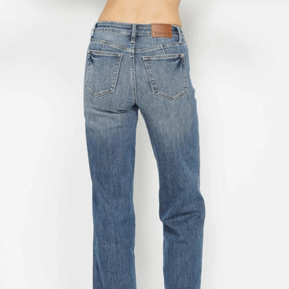 Back view of high-waist straight-leg jeans showing the classic pocket design.