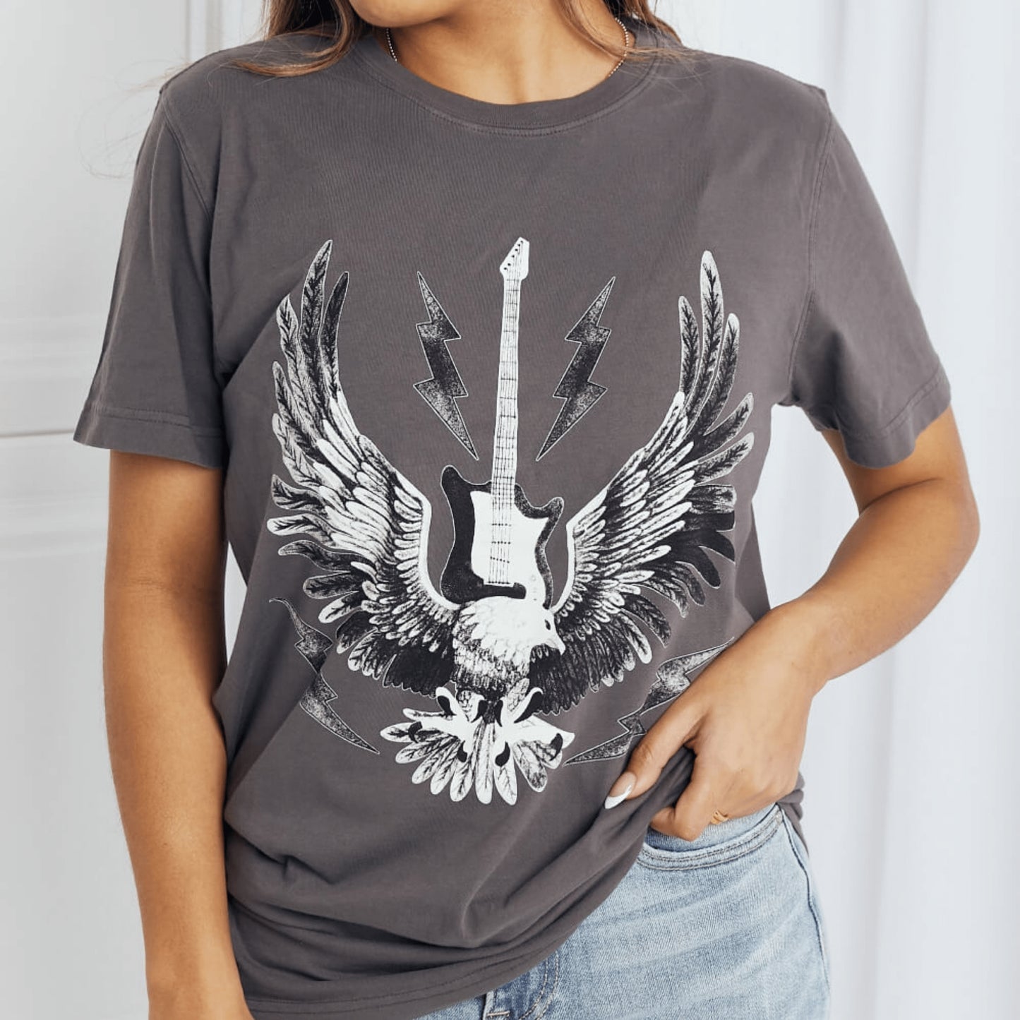 Posterior fit view of the charcoal cotton graphic tee against a neutral background.