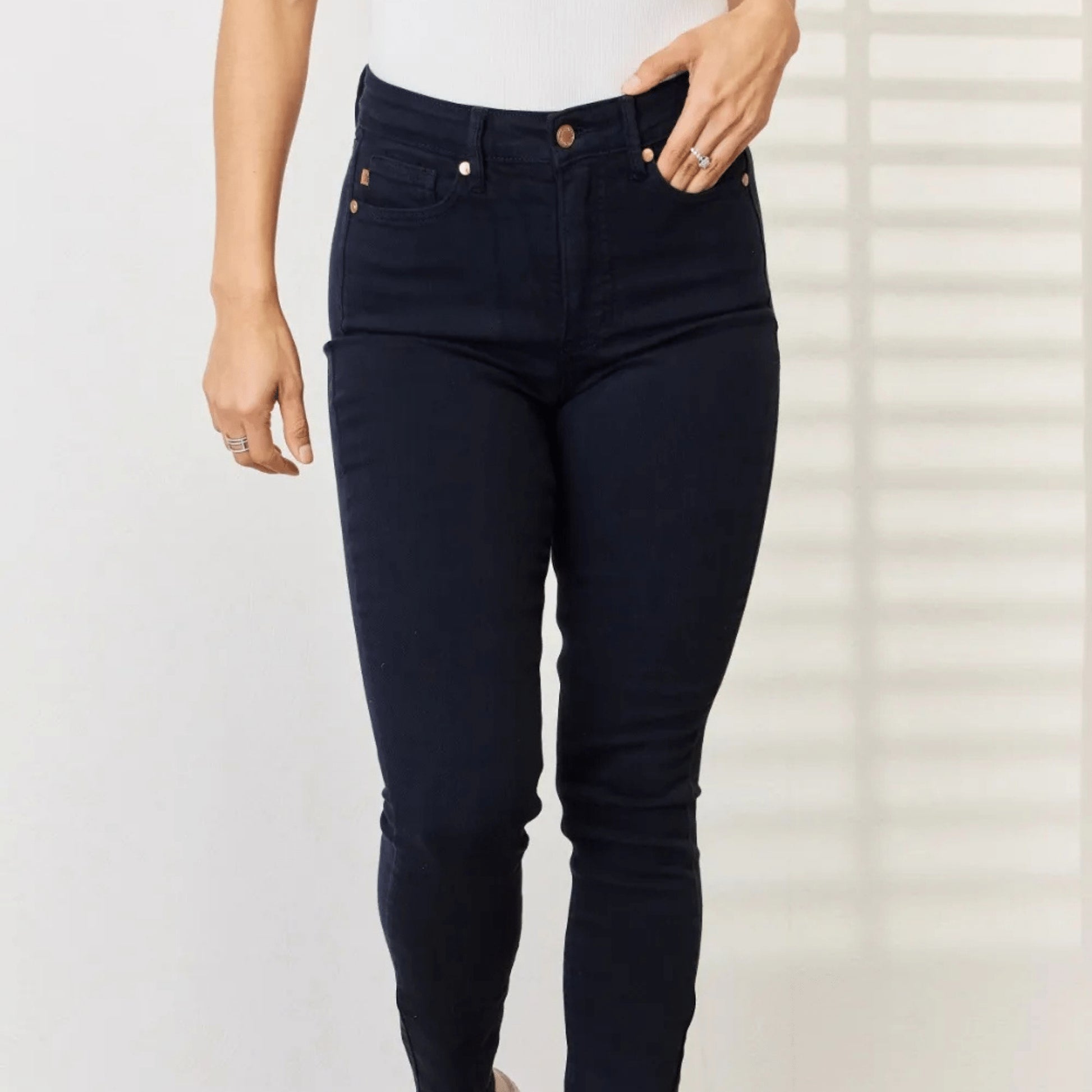 Frontal display of the garment dyed tummy control skinny jeans.