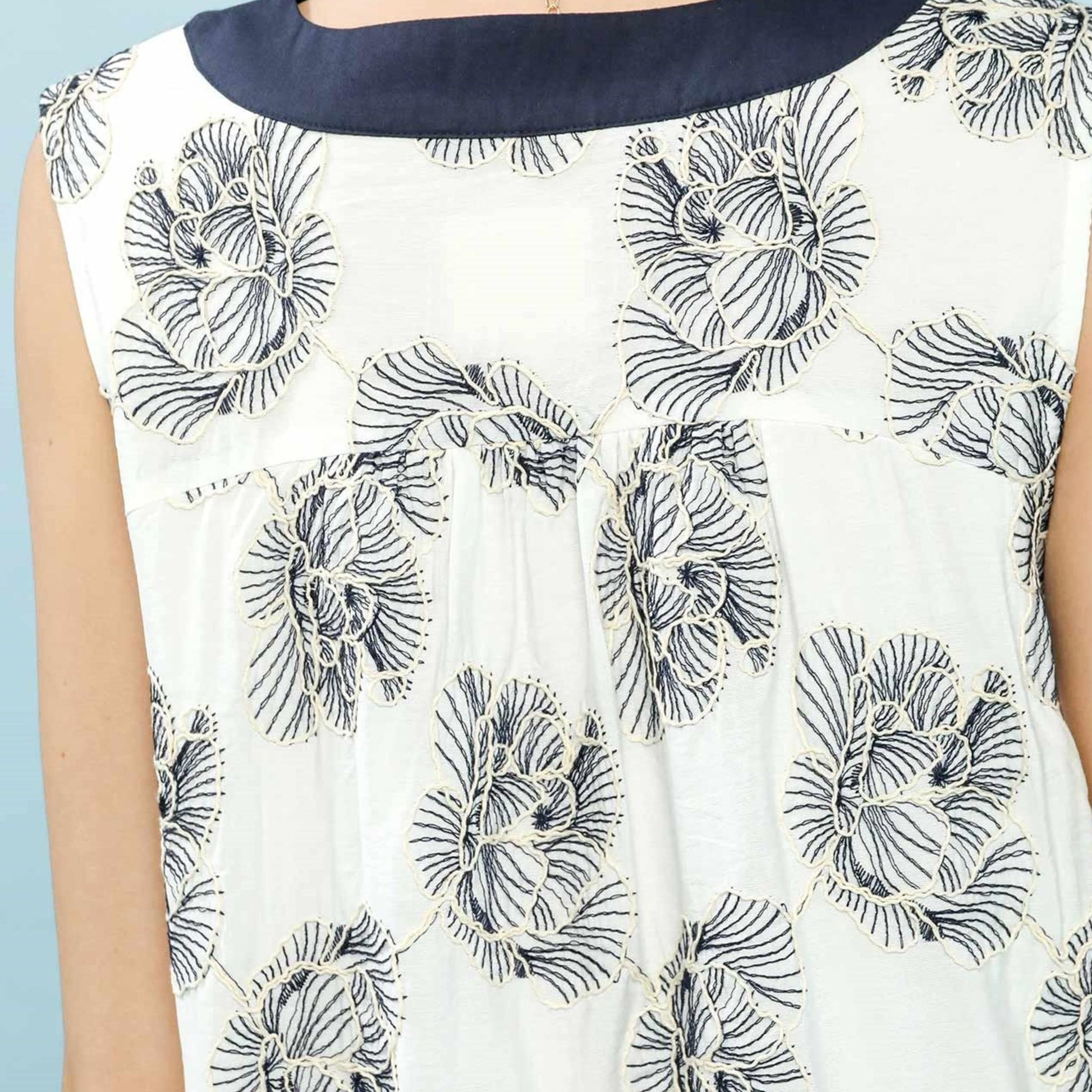 Lifestyle view of the Umgee floral sleeveless dress, perfect for a casual summer brunch.