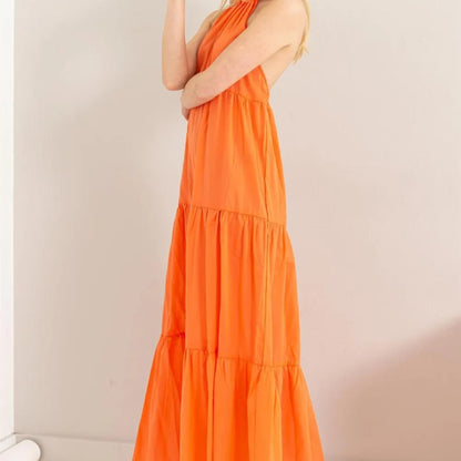 Side view of the HYFVE tiered maxi dress showcasing the flowing silhouette.