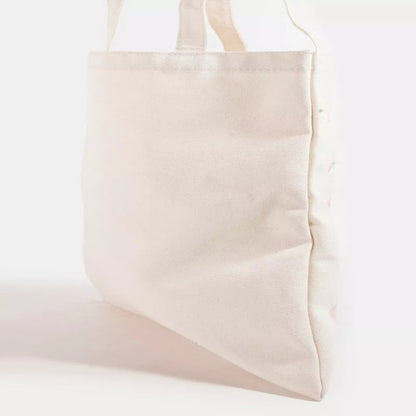 Close-up of the pink ribbon bow tote bag showing the soft material and delicate bow pattern