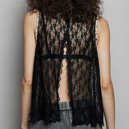 Full view of the POL black cotton sleeveless blouse with floral print.