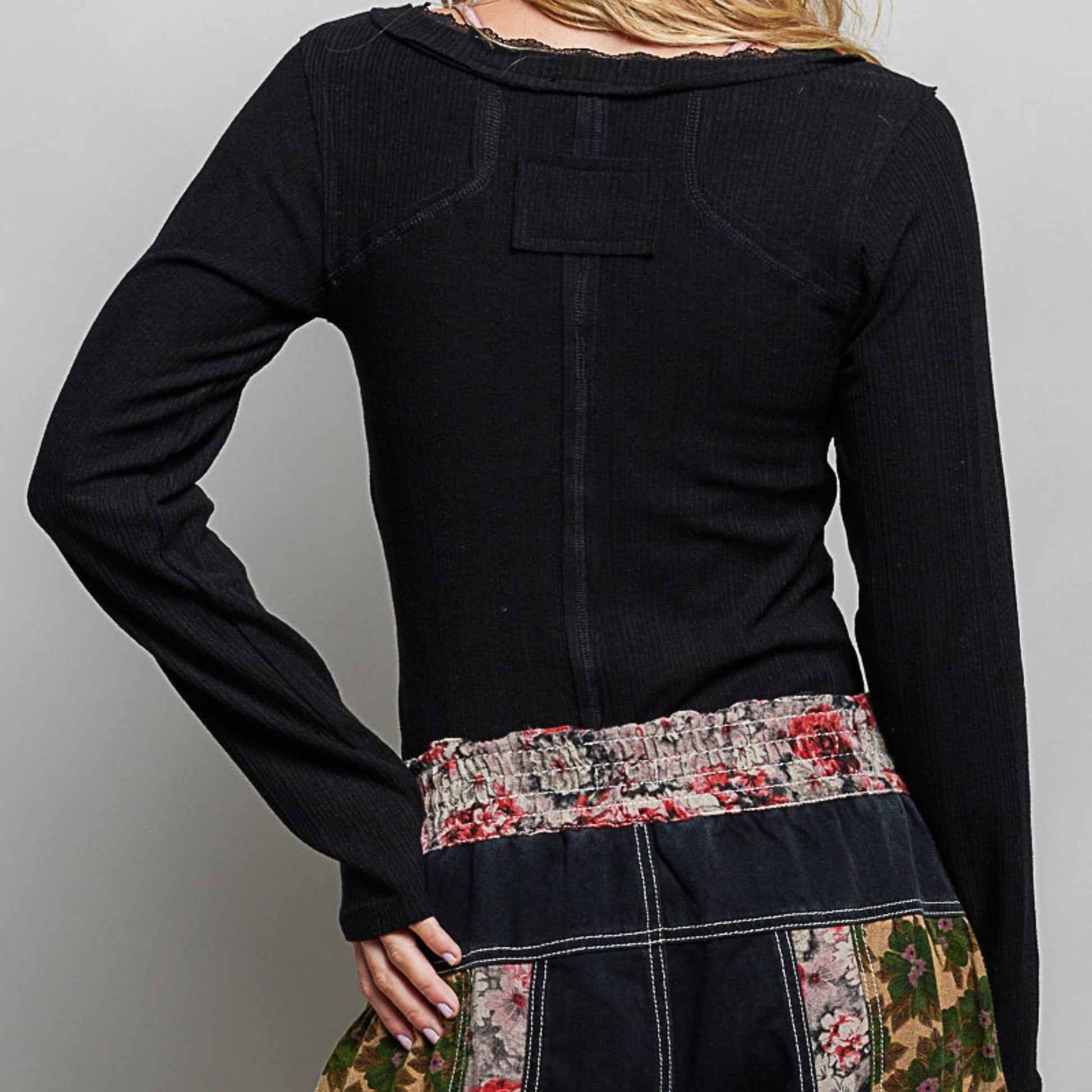 POL black v-neck long sleeve ribbed top with outseam detail — back view.