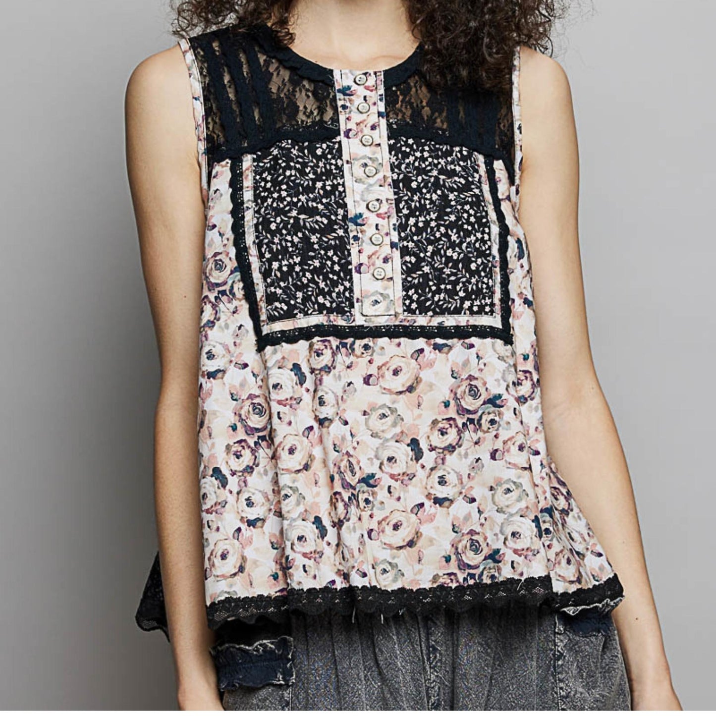 POL black printed sleeveless top with intricate lace back and button detail.