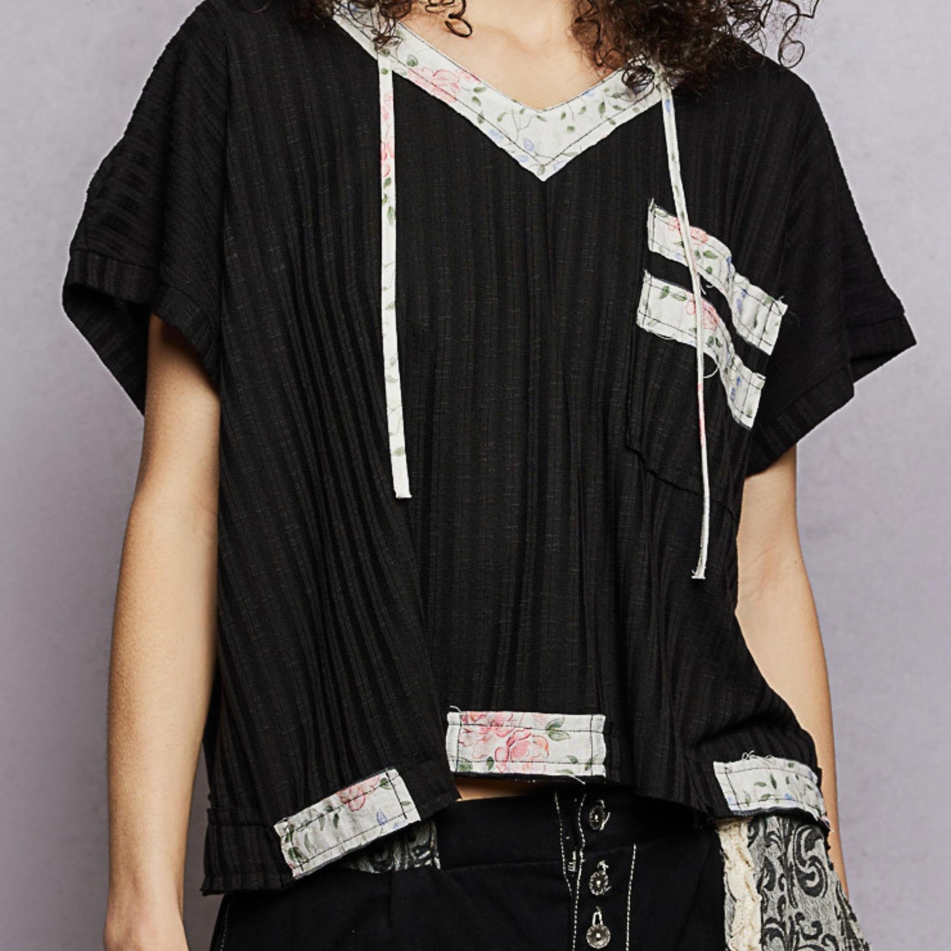 POL black short sleeve hooded top with open back detail — frontal display.