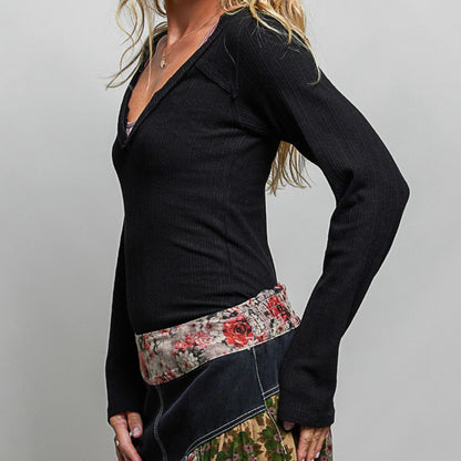 POL black v-neck long sleeve ribbed top showing slim fit — side perspective.
