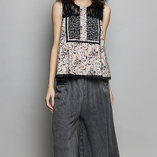 Lifestyle styling of the POL lace back top with wide-leg summer trousers.