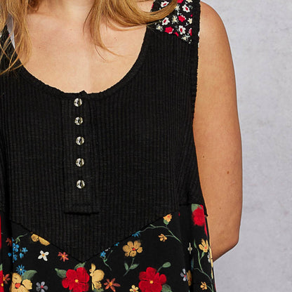 Close-up of the woven floral patch and rustic metal buttons.