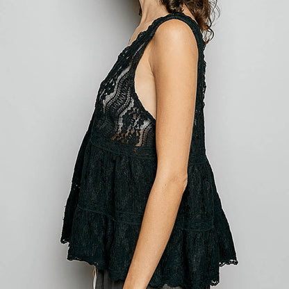 Lateral perspective of the elegant POL black lace top highlighting the flowy fit.