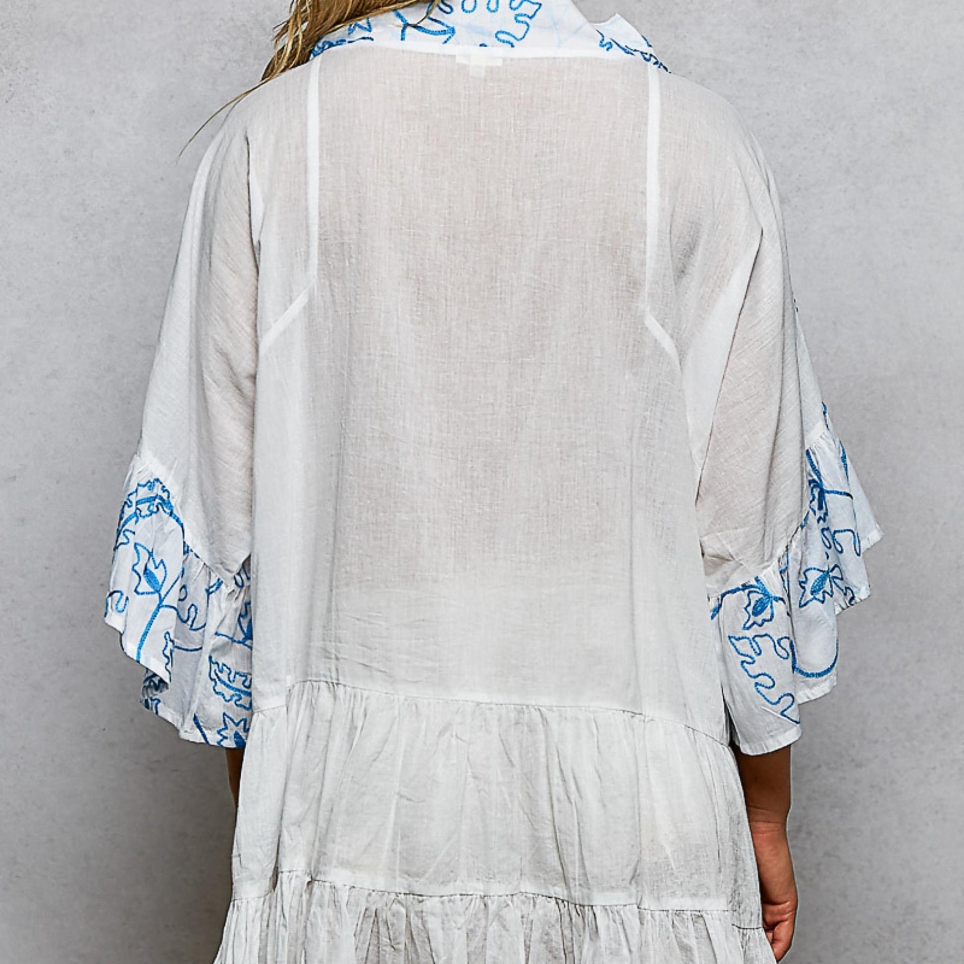 POL ivory multi floral tiered ruffle dress with tiered skirt — back view.