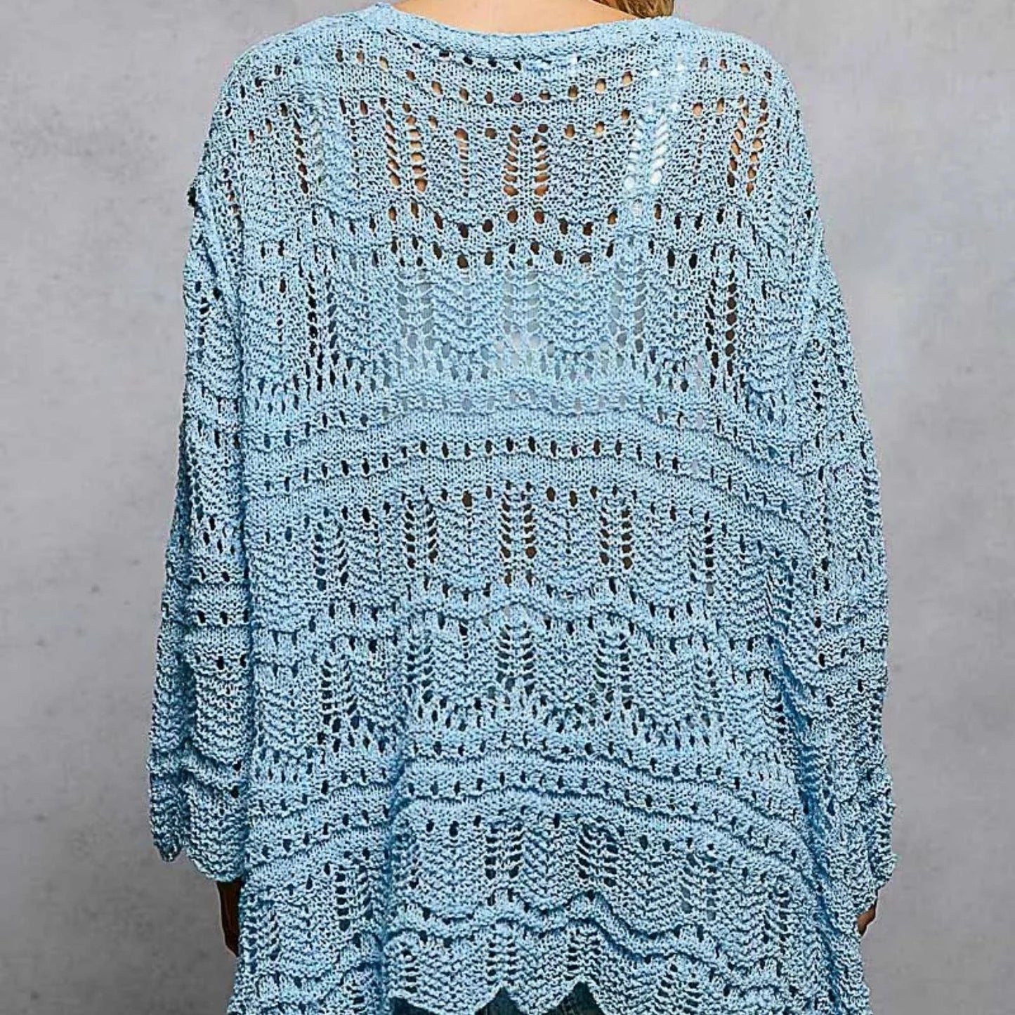 Back view of the POL sky blue cardigan showing the relaxed, oversized fit.