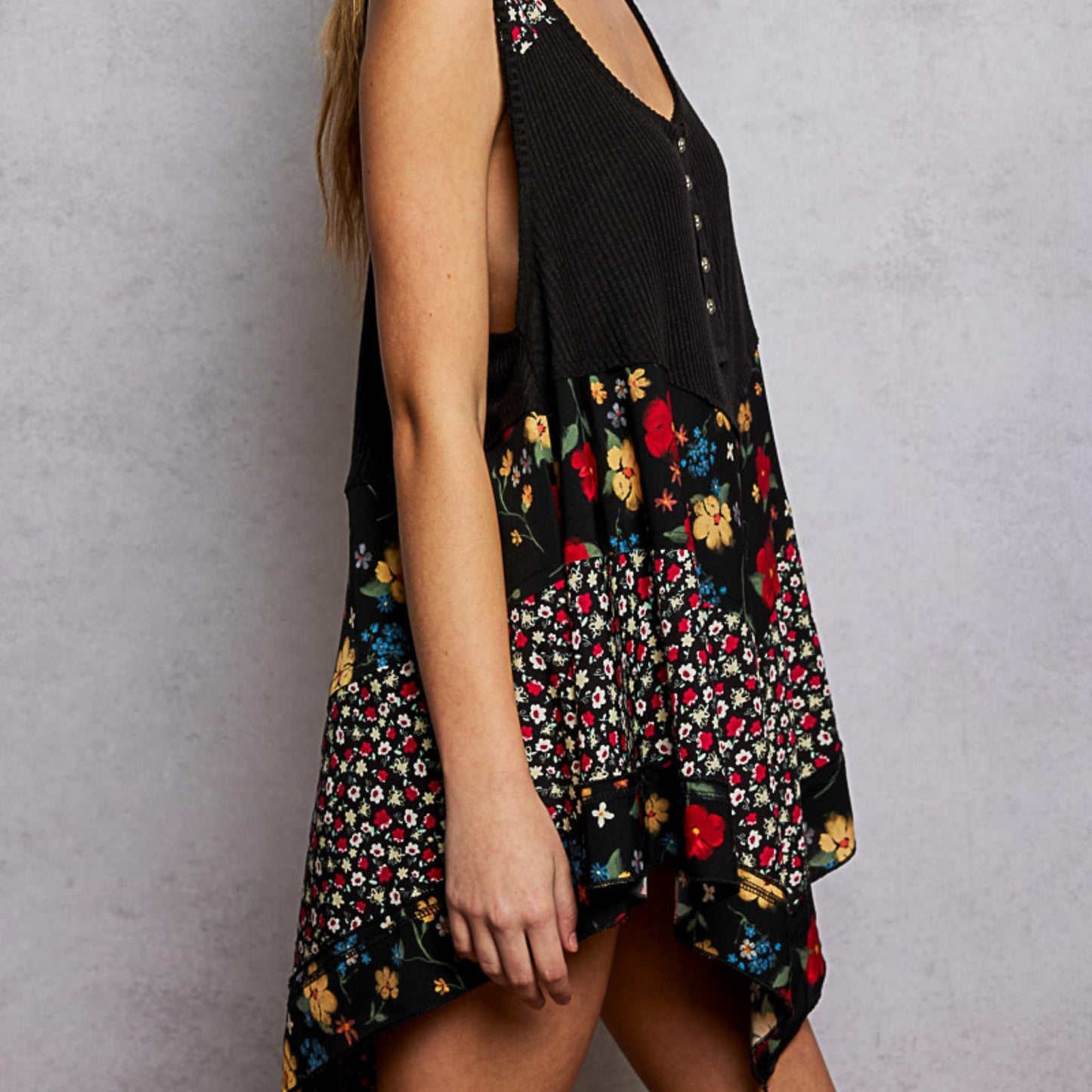 Side perspective of the POL black ribbed tank highlighting the floral pattern.
