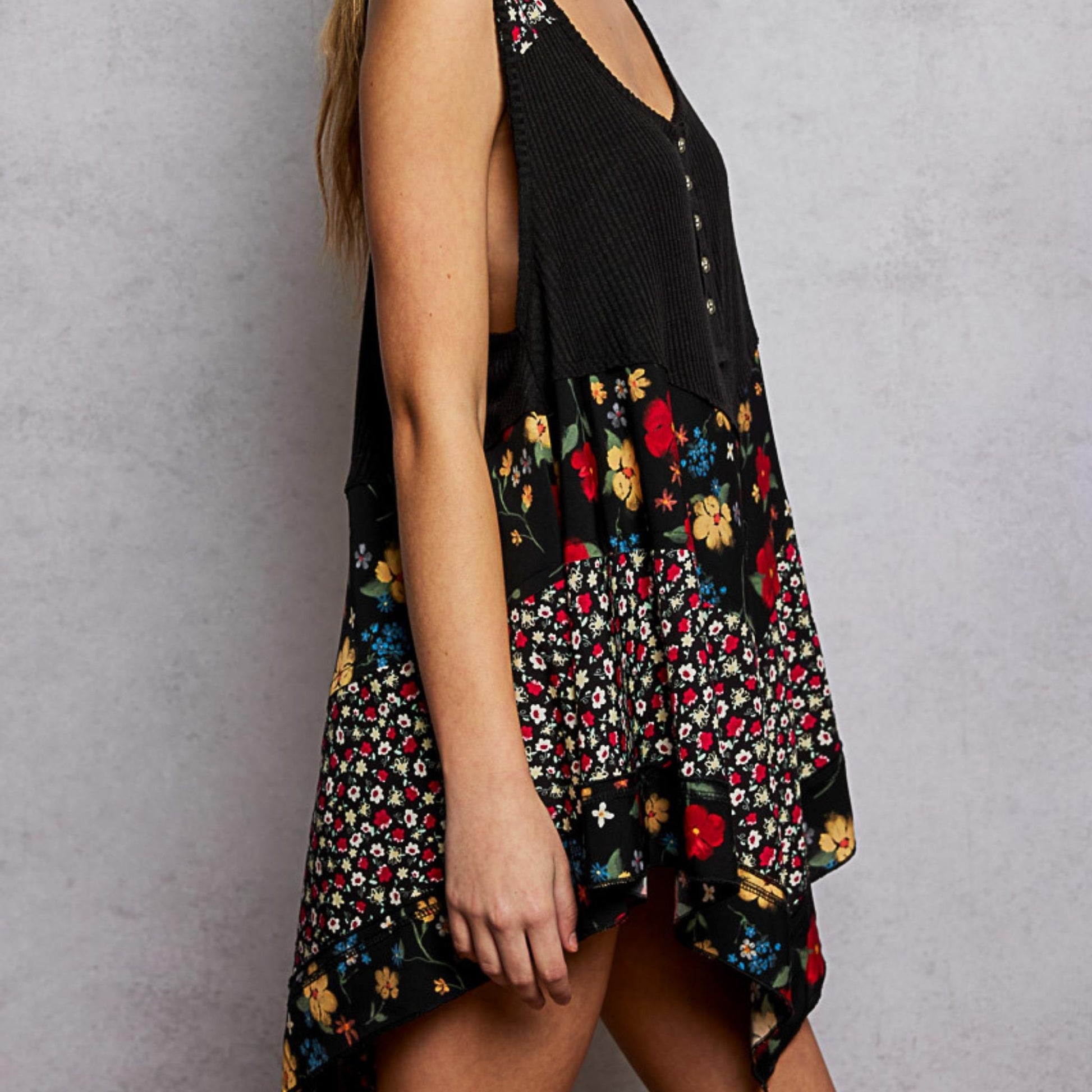 Side perspective of the POL black ribbed tank highlighting the floral pattern.