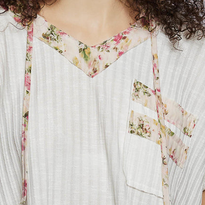POL off white short sleeve hooded top with hood and pocket — detail close-up.