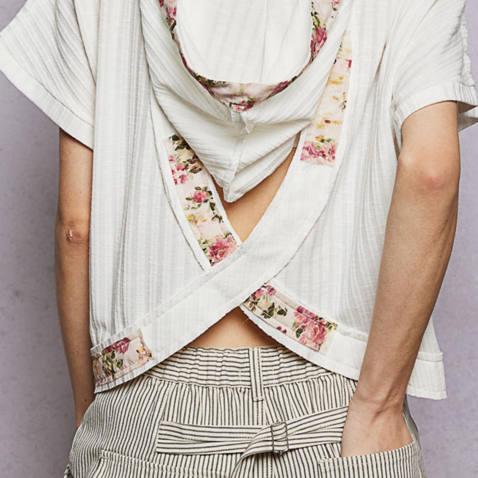 POL off white short sleeve hooded top showing stylish open back — back view.