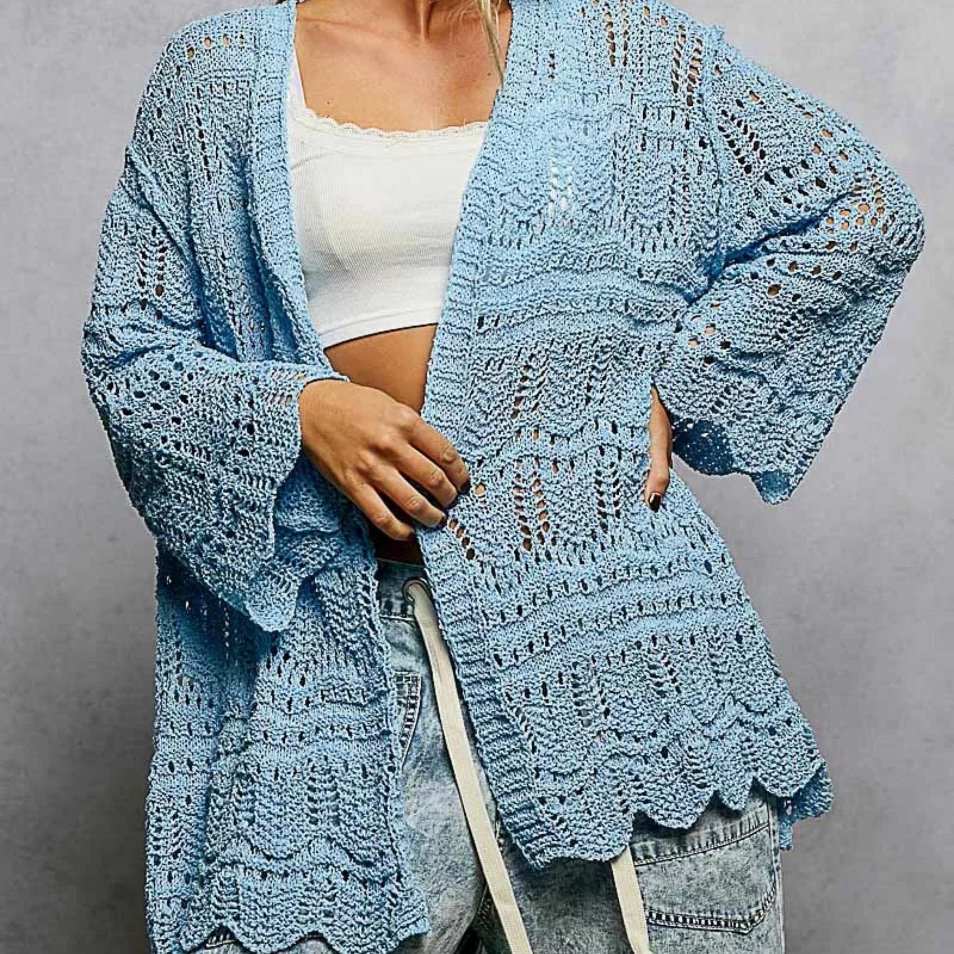 Lifestyle styling of the POL openwork cardigan paired with white summer staples.