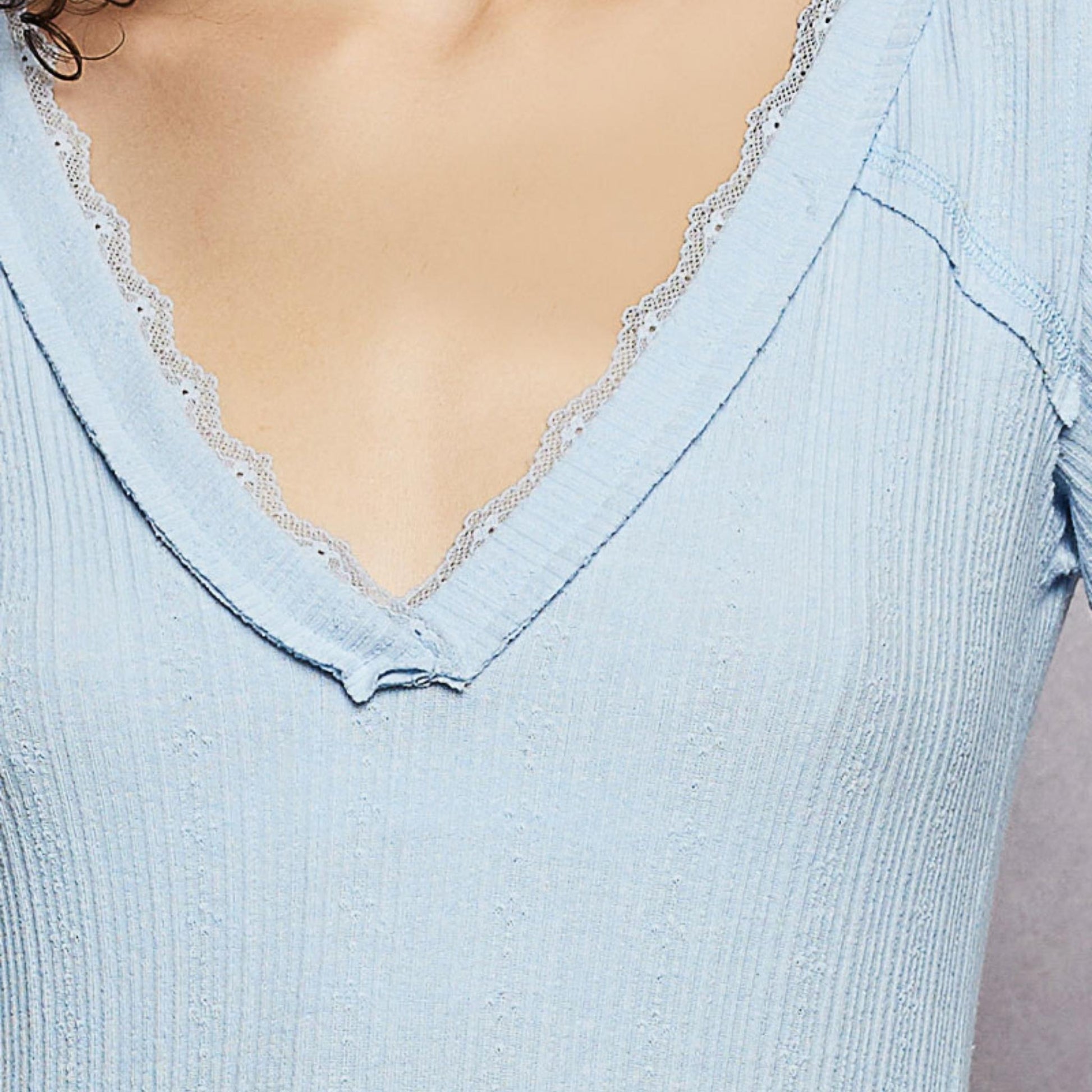 POL powder blue v-neck long sleeve ribbed top with delicate lace trim — complete presentation.