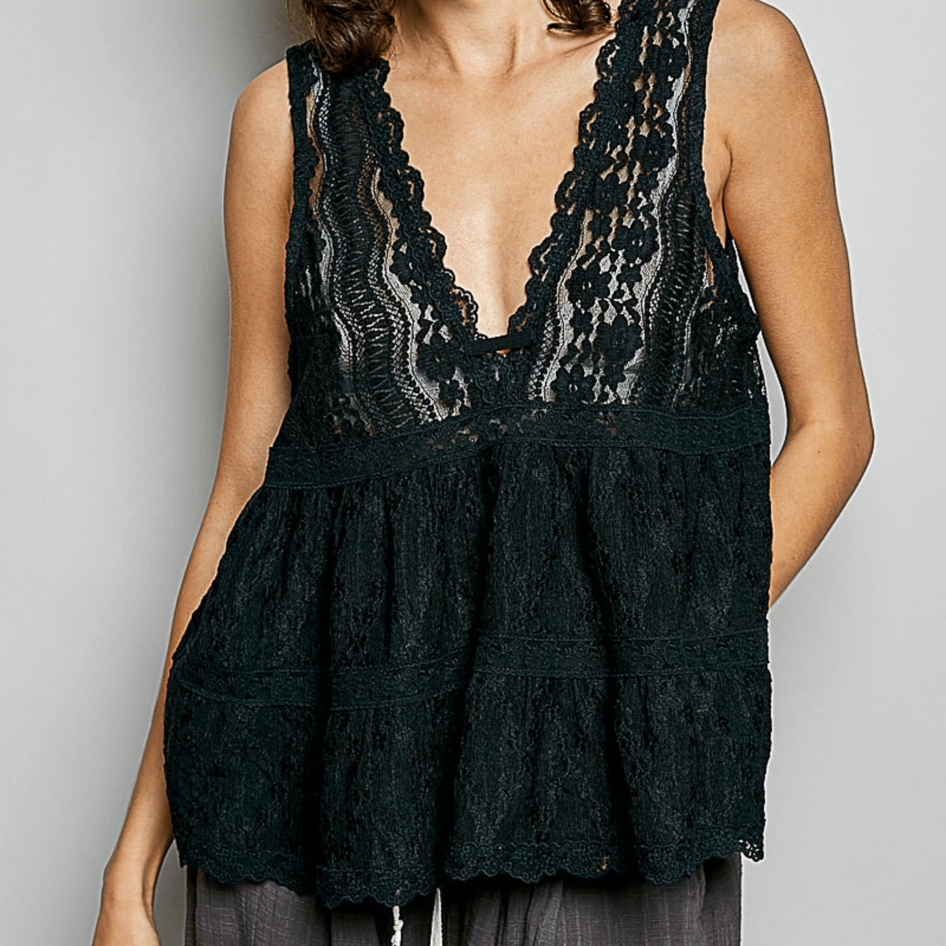 Frontal view of the POL scalloped lace sleeveless top showing the tiered bodice.