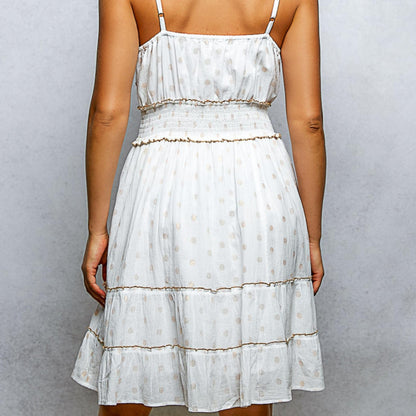 Back view of the ivory POL tassel mini dress on a model showing thin straps.