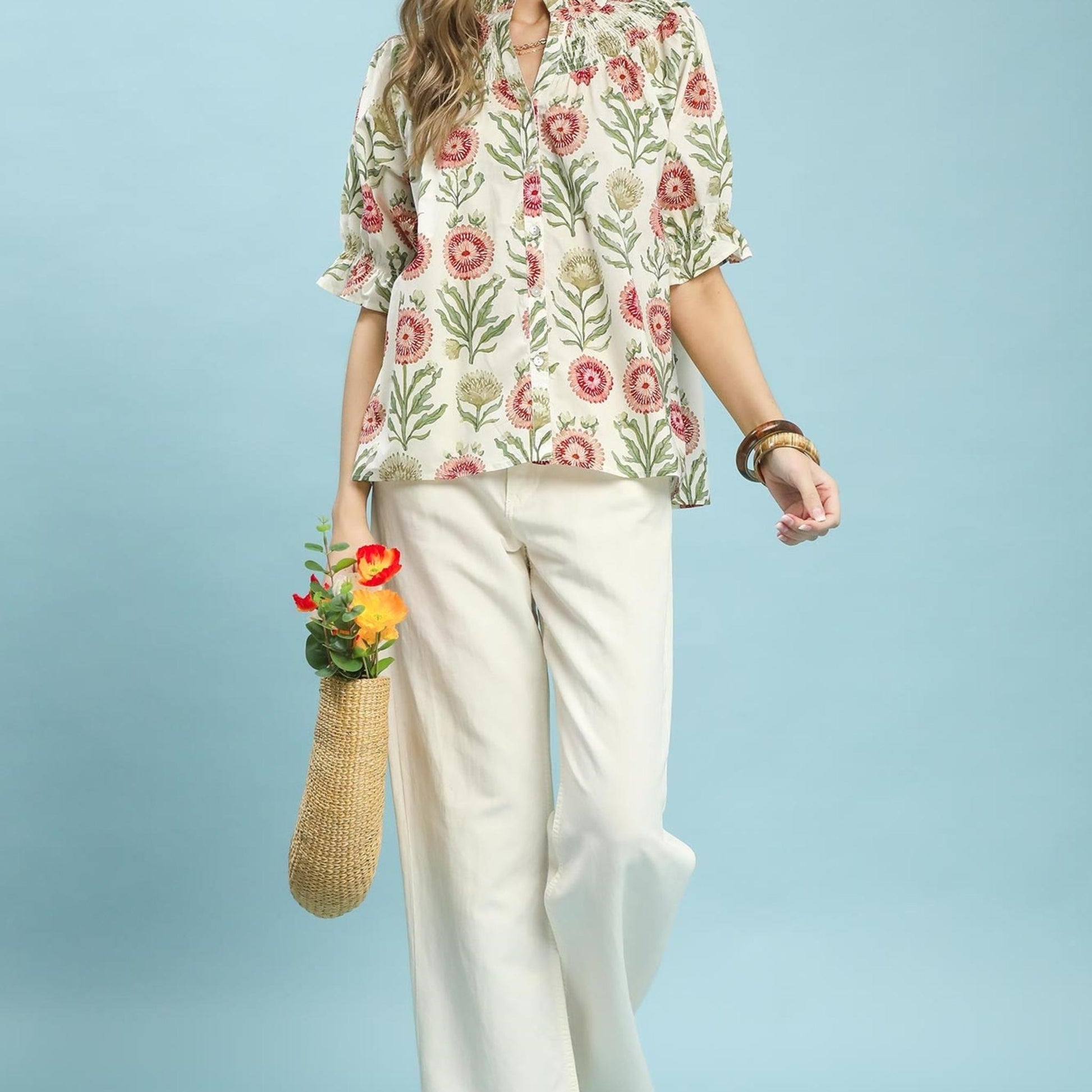 Lifestyle view of the Umgee floral top paired with denim for a casual, bohemian-inspired outfit.