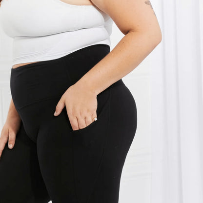 Styling example of black reflective leggings for a versatile gym-to-street boutique look.