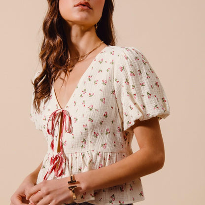 Full-length view of the relaxed fit floral gauze top, showcasing the airy silhouette and feminine ditsy print.