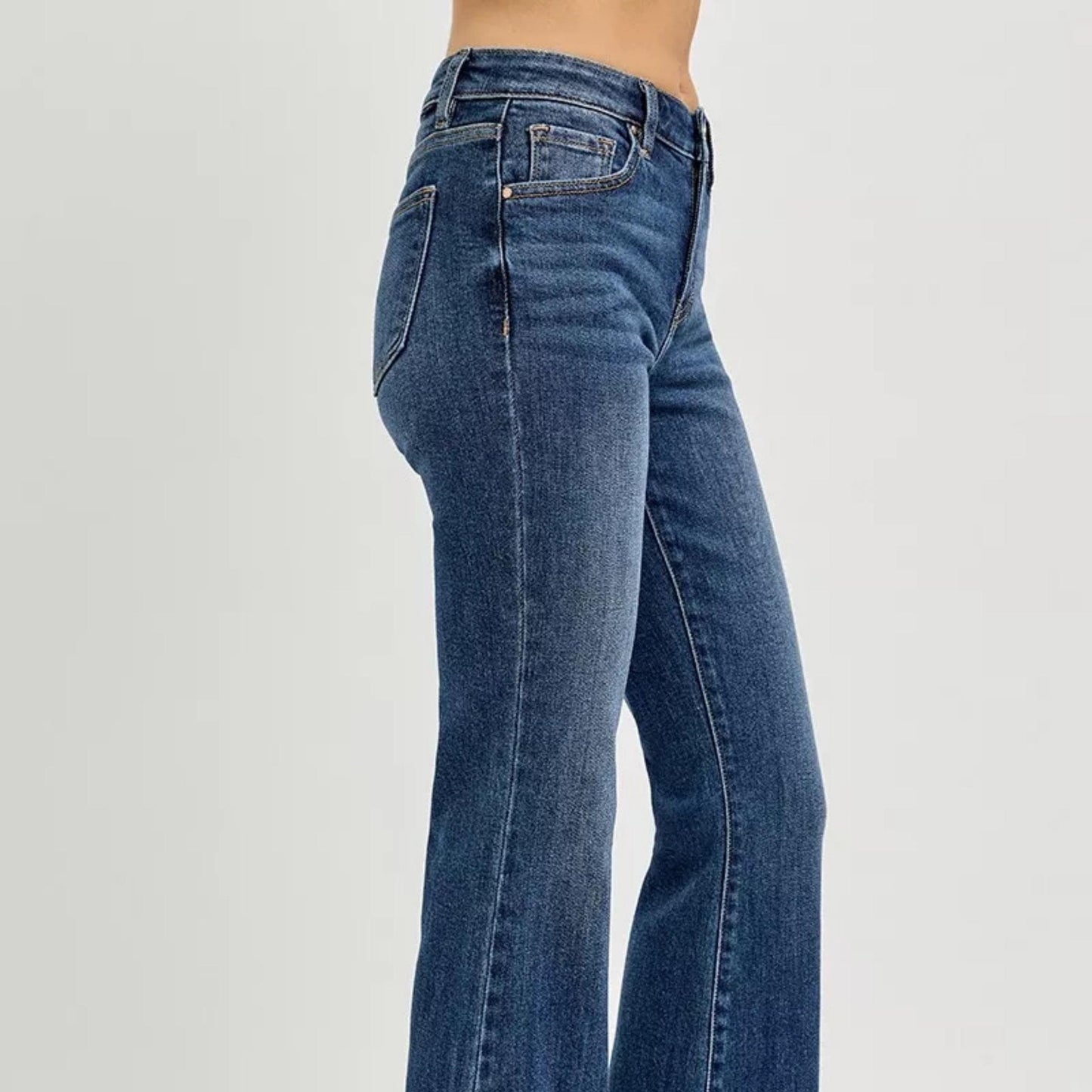 Side profile of RISEN flare jeans showing the flattering leg shape.