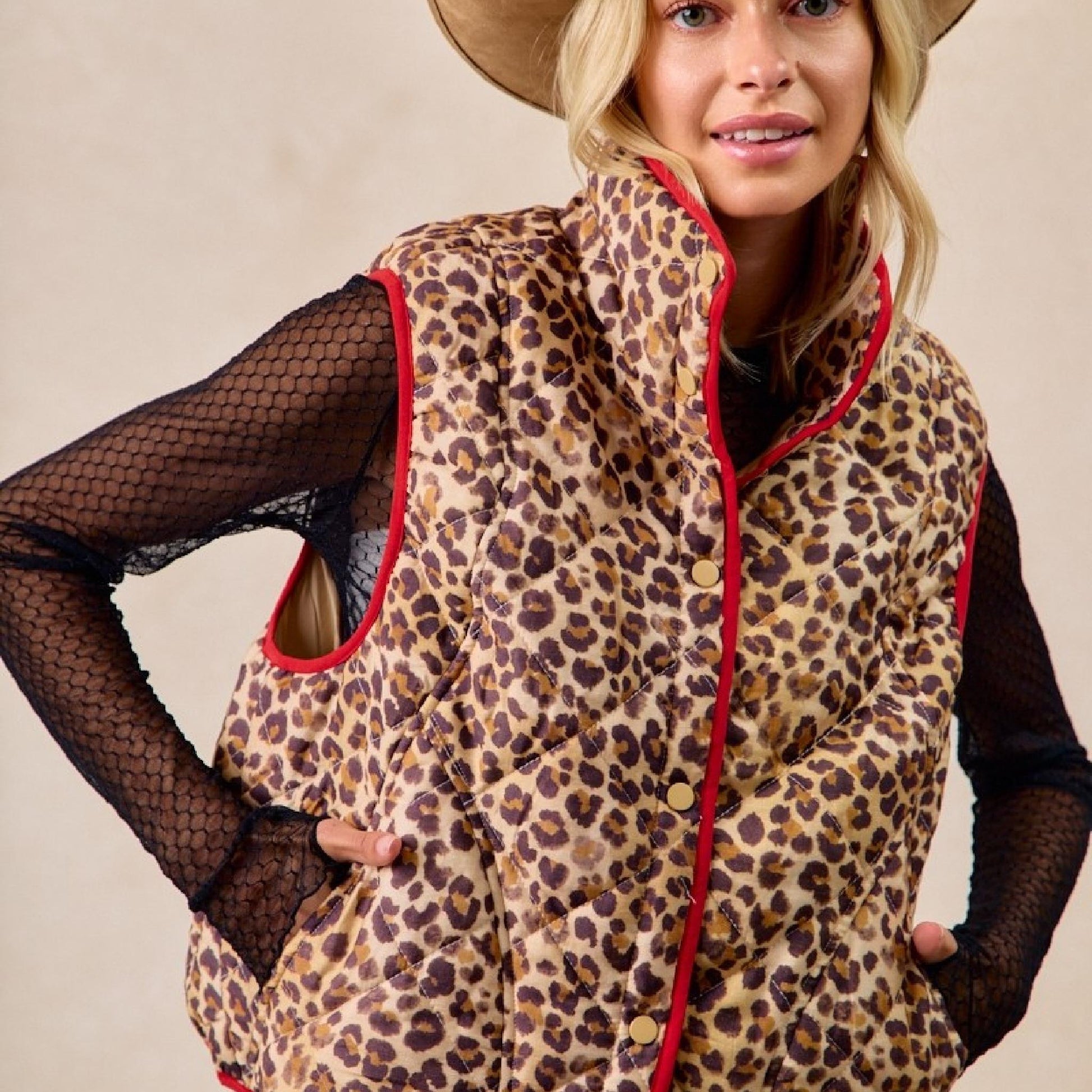 Front view of a woman wearing the neutral Bibi leopard print quilted vest