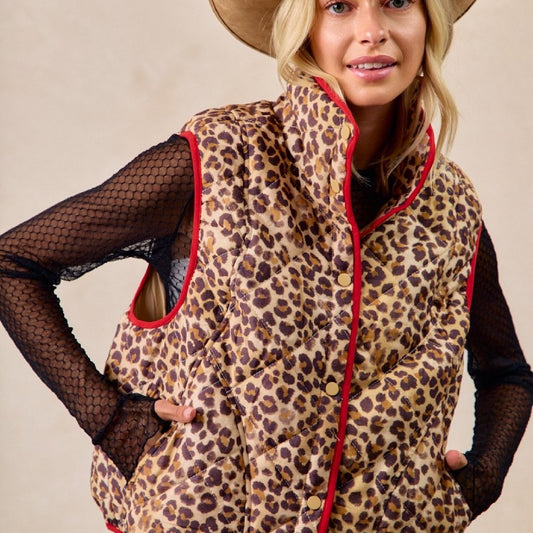 Front view of a woman wearing the neutral Bibi leopard print quilted vest