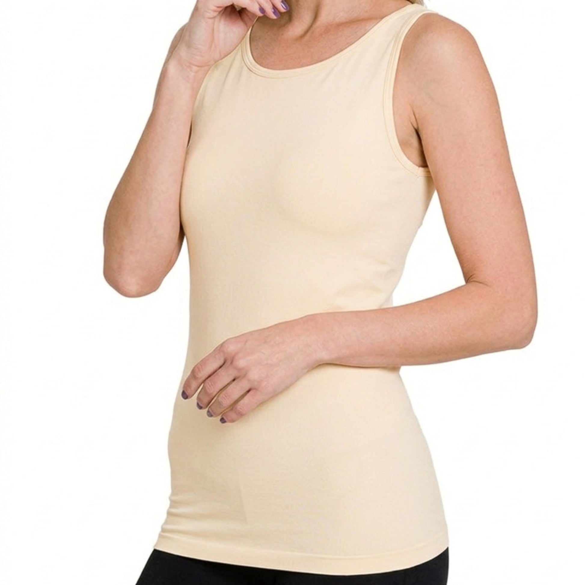 Close-up of the smooth seamless construction and neutral stretchy fabric on the sand beige tank.