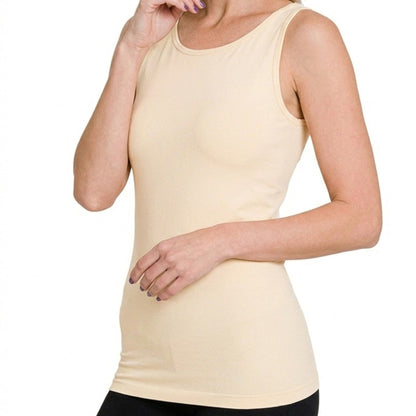Close-up of the smooth seamless construction and neutral stretchy fabric on the sand beige tank.