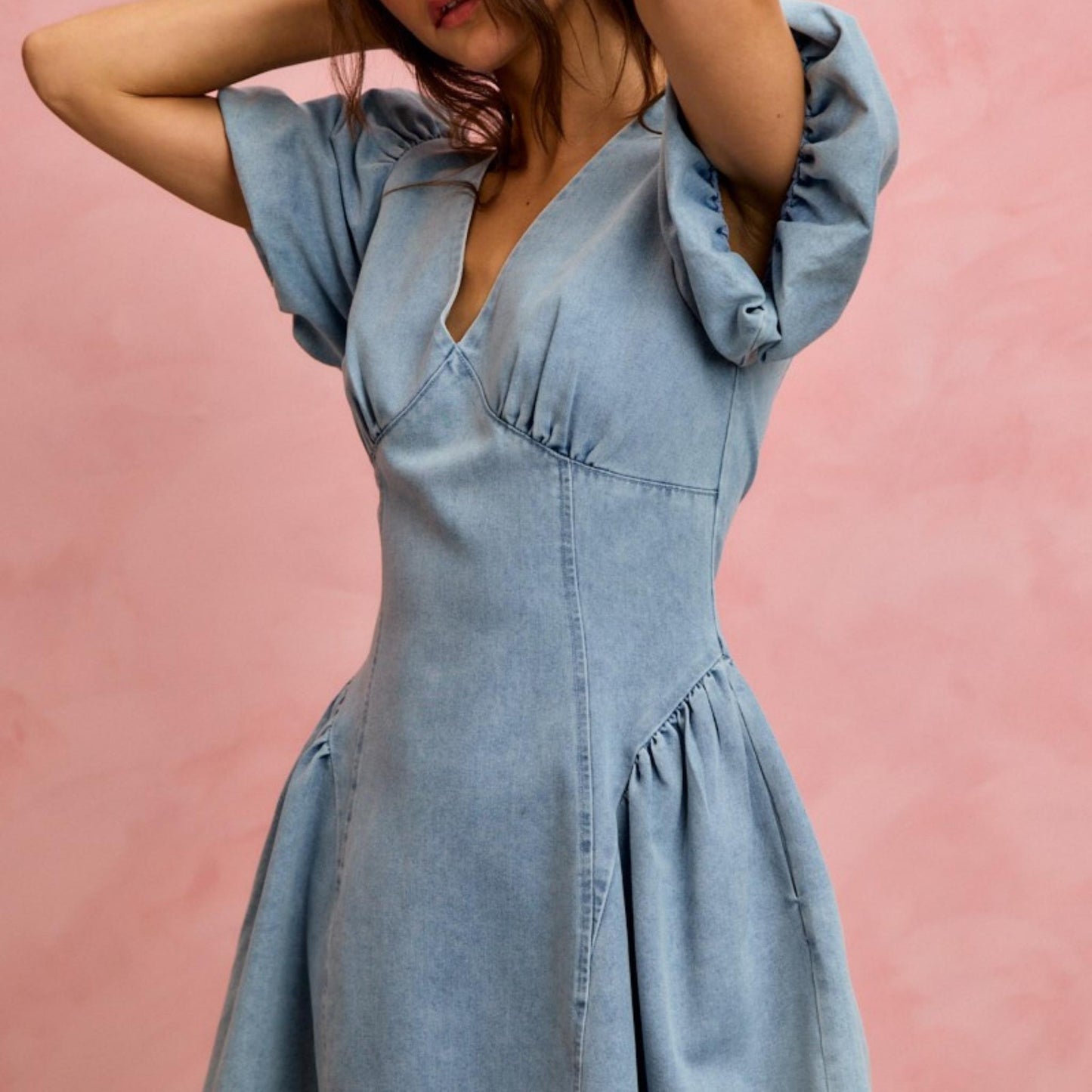 Back view of the SO ME light denim dress highlighting the zipper closure.