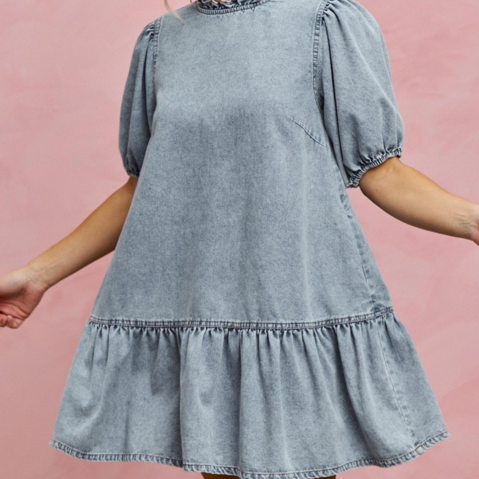 Front view of the SO ME light wash denim mini dress featuring puff sleeves.