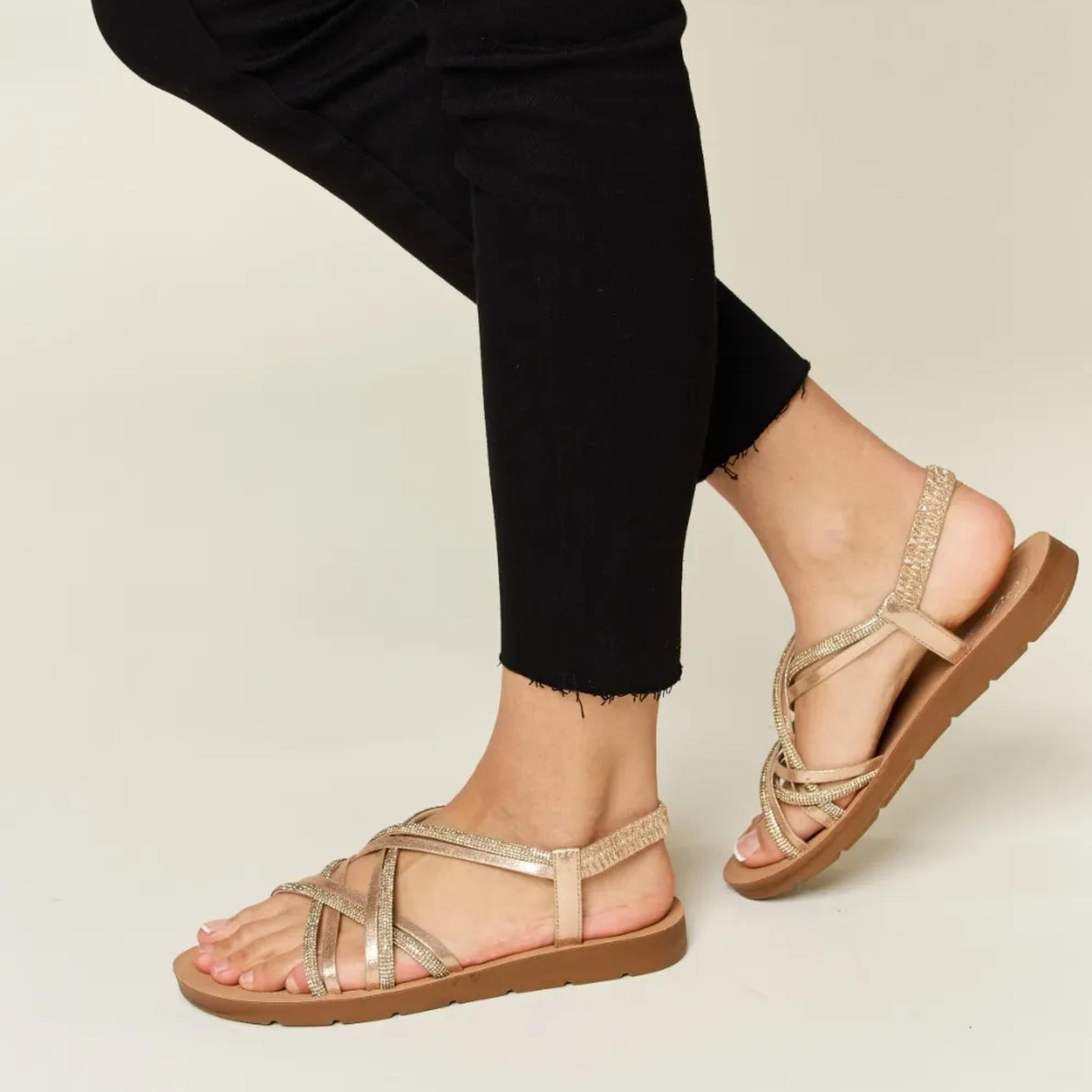 Lifestyle view of the gold sparkly summer sandals, perfect for vacation or brunch outfits.