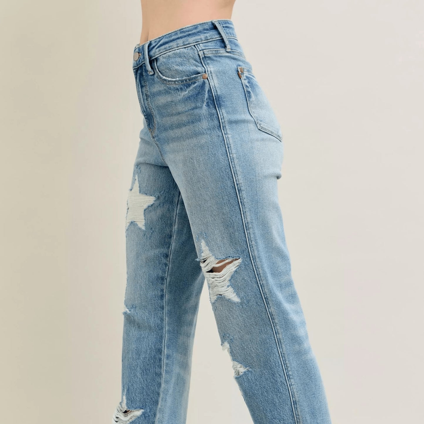 Side view of star-patterned 90s straight jeans in medium wash.