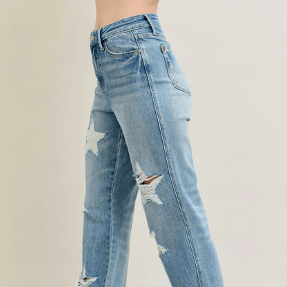 Side view of star-patterned 90s straight jeans in medium wash.